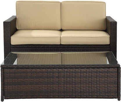 Crosley Furniture Palm Harbor 2-Piece Wicker Outdoor Coffee Table and Loveseat Patio Furniture Set for Porch, Brown with Sand Cushions