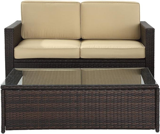 Crosley Furniture Palm Harbor 2-Piece Wicker Outdoor Coffee Table and Loveseat Patio Furniture Set for Porch, Brown with Sand Cushions