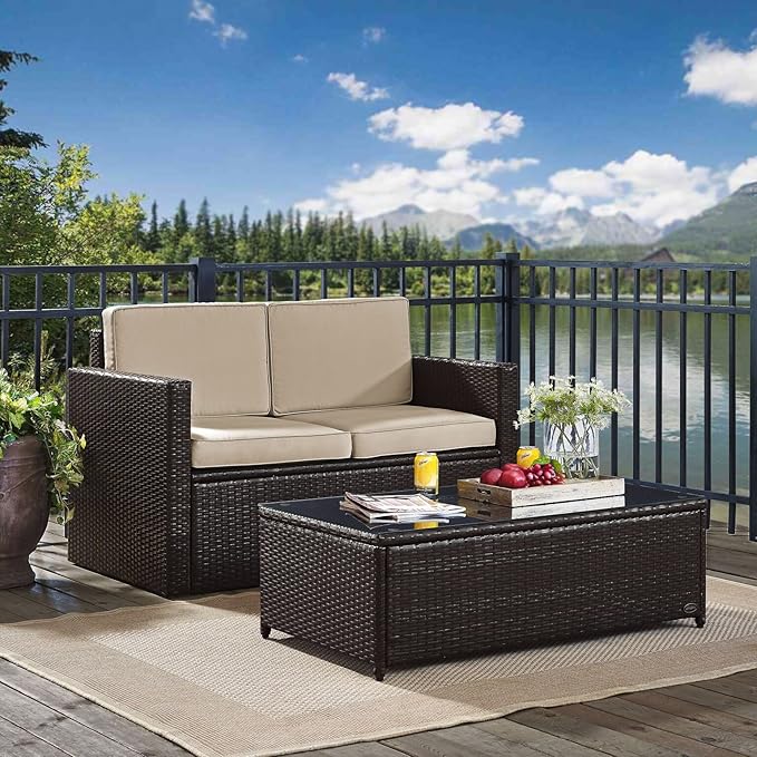 Crosley Furniture Palm Harbor 2-Piece Wicker Outdoor Coffee Table and Loveseat Patio Furniture Set for Porch, Brown with Sand Cushions