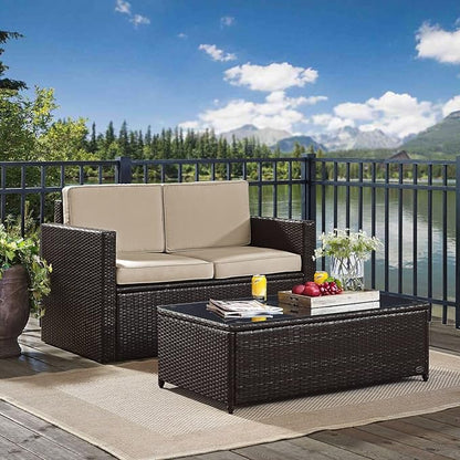 Crosley Furniture Palm Harbor 2-Piece Wicker Outdoor Coffee Table and Loveseat Patio Furniture Set for Porch, Brown with Sand Cushions