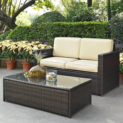 Crosley Furniture Palm Harbor 2-Piece Wicker Outdoor Coffee Table and Loveseat Patio Furniture Set for Porch, Brown with Sand Cushions